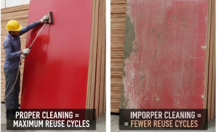 Worker cleaning shuttering plywood with plastic scraper